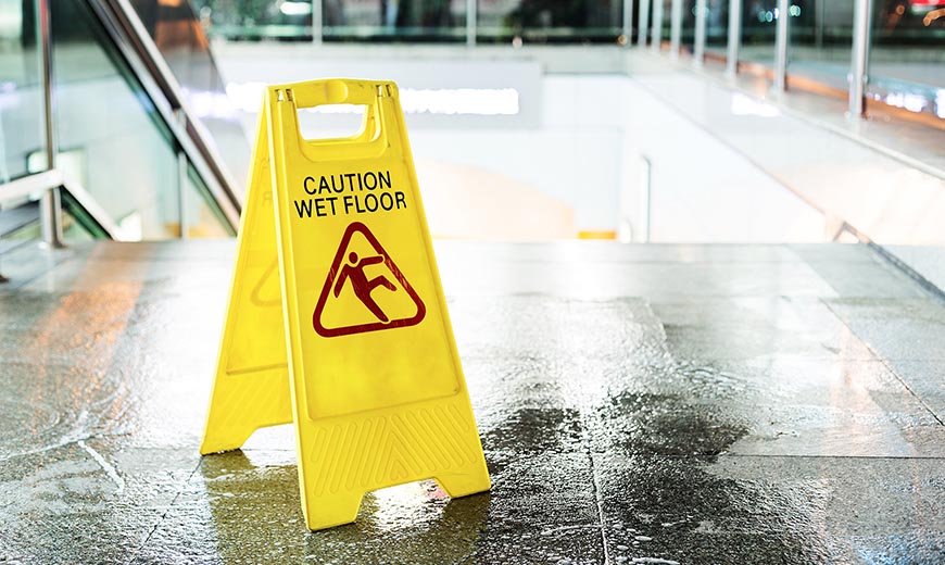 slip and fall caution sign - contact a slip & fall lawyer in Las Vegas today