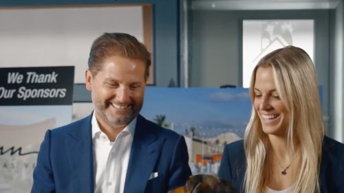 sam and ash smiling while looking at rocky