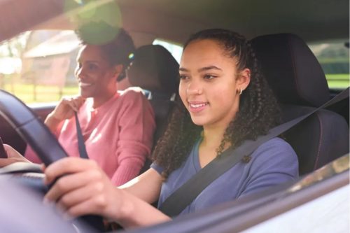 teen driving with mom in passengers seat