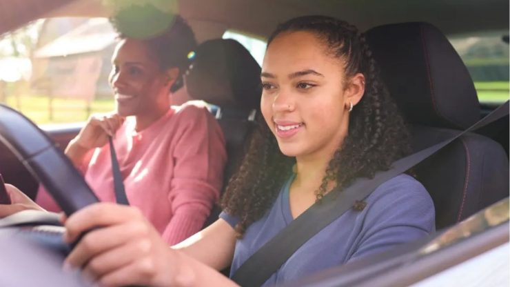 teen driving with mom in passengers seat