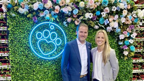 Confident professionals stand together against a vibrant floral backdrop, embodying care and advocacy.