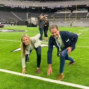 A lively group on a vibrant field conveys teamwork and celebration, reflecting community and support.