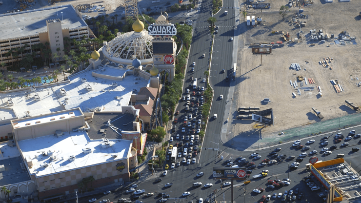 A bustling urban scene showcases traffic and iconic landmarks, reflecting a dynamic, engaged community.