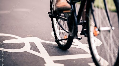 close up of someone's feet riding a bike