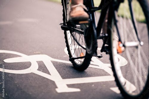 close up of someone's feet riding a bike
