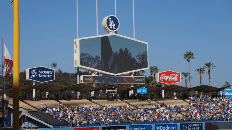 A vibrant stadium scene captures engaged fans, reflecting community spirit and resilience.