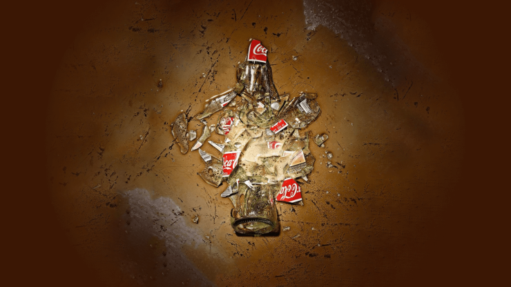 Shattered glass and spilled soda evoke urgency, highlighting the importance of safety and advocacy.