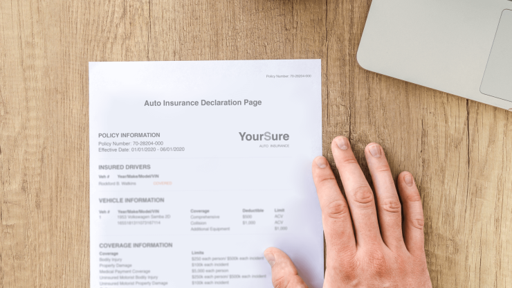 An insurance declaration page on a wooden desk reflects diligence and preparedness for advocacy.