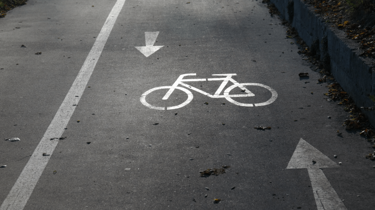 A clear bike lane marked for safety, reflecting a commitment to cyclist advocacy and community well-being.
