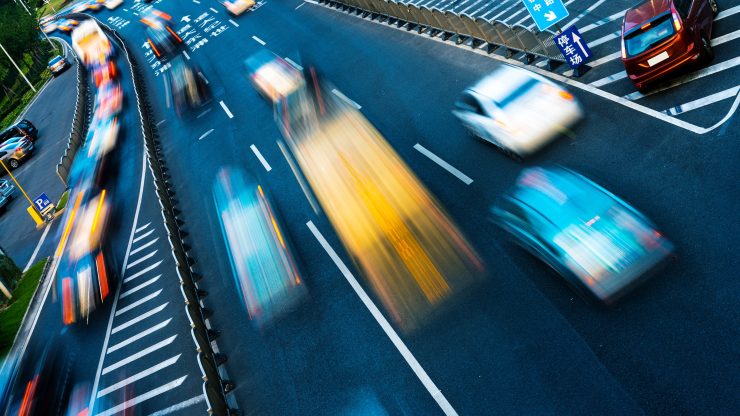 Dynamic traffic scene illustrating the urgency and complexity of road safety, emphasizing advocacy.