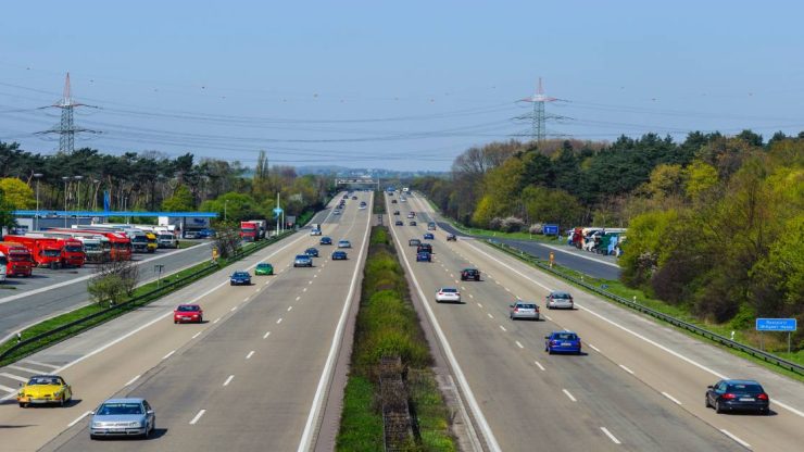 A busy highway scene conveys a sense of movement and urgency, reflecting the importance of road safety.
