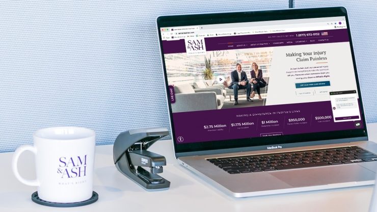 A professional workspace showcases a laptop displaying a personal injury law firm's website, exuding trust and care.