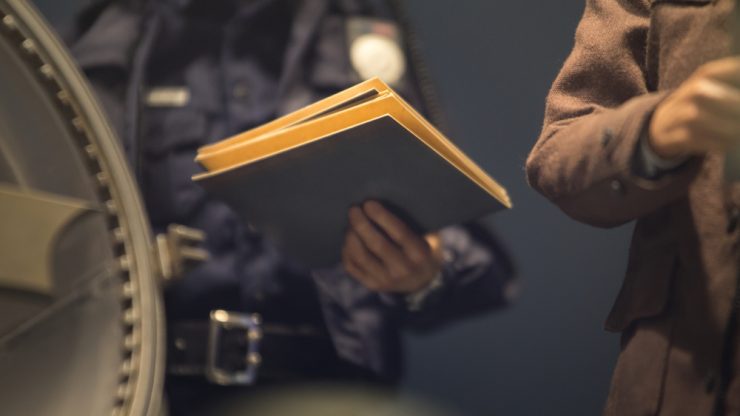 policeman reviewing files
