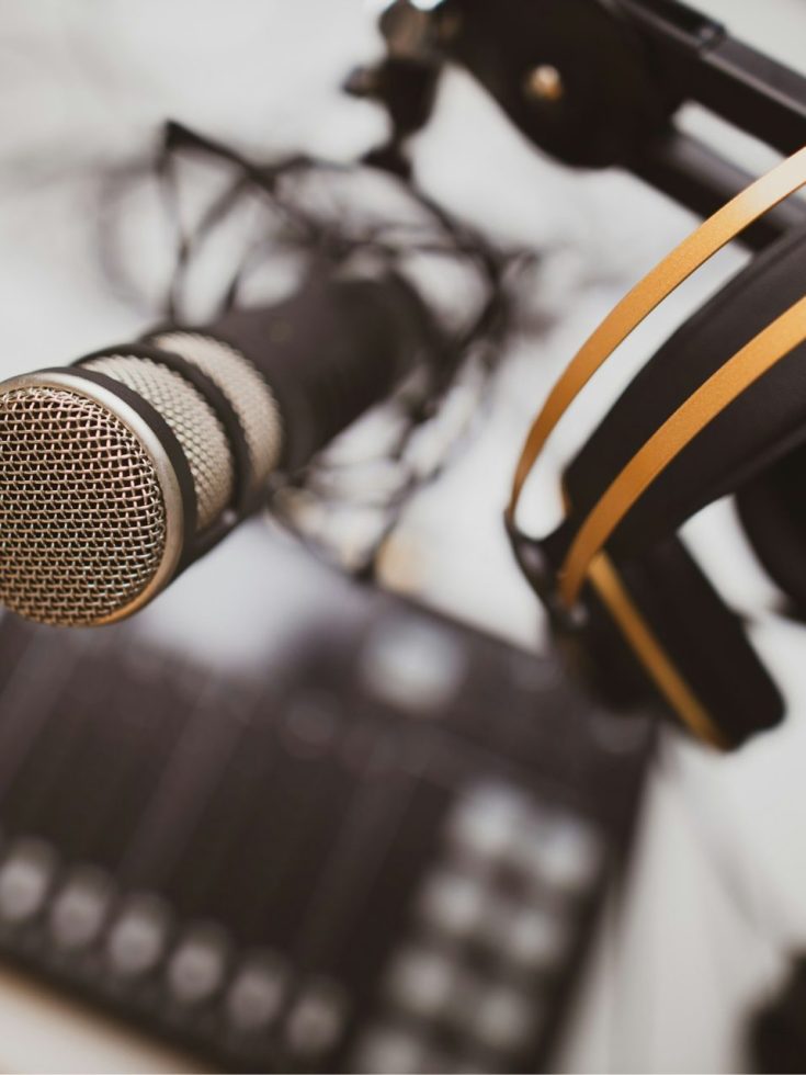A professional setting with a microphone and headphones, symbolizing clear communication and support.