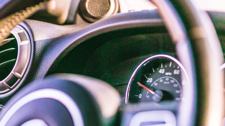A close-up view of a car's interior conveys focus and readiness, emphasizing safety and responsibility.