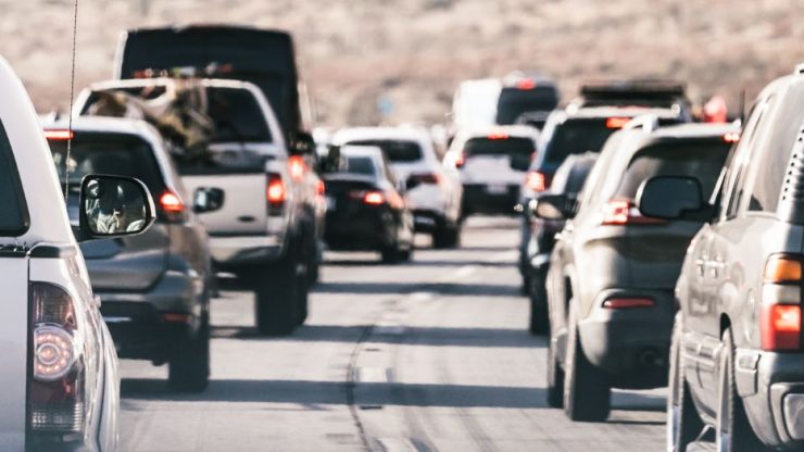 Heavy traffic on a sunlit road, highlighting the potential for accidents and the need for legal support.