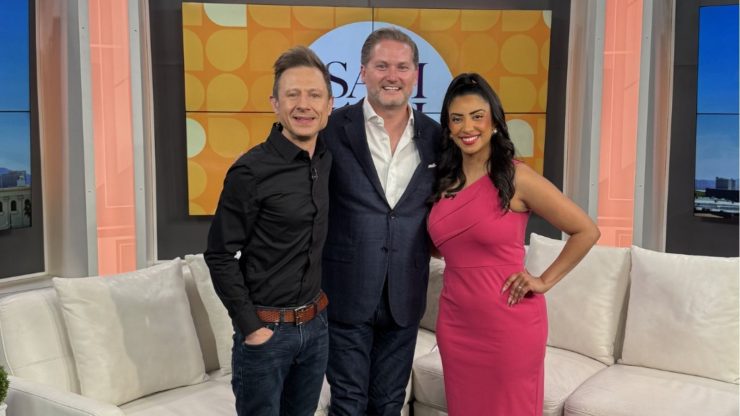 A confident team stands together in a welcoming studio, radiating warmth and professionalism.