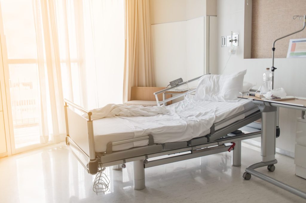 A hospital room bathed in soft light, conveying a sense of care and recovery.