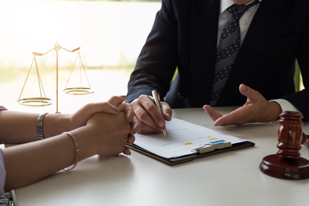 A lawyer attentively discusses a case with a client, fostering trust and understanding.