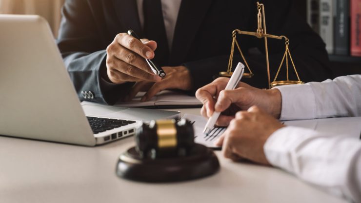 A professional discussion unfolds, highlighting commitment to justice and client advocacy.