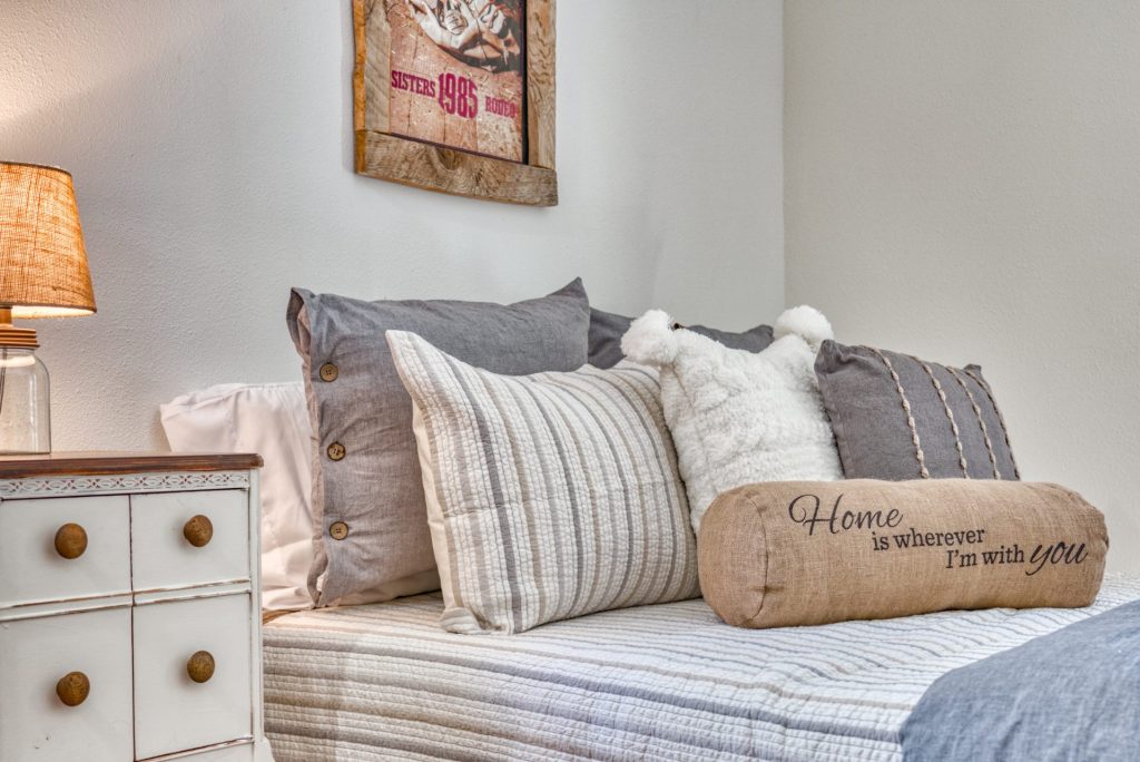 A serene bedroom setting exudes comfort and care, inviting a sense of safety and warmth.