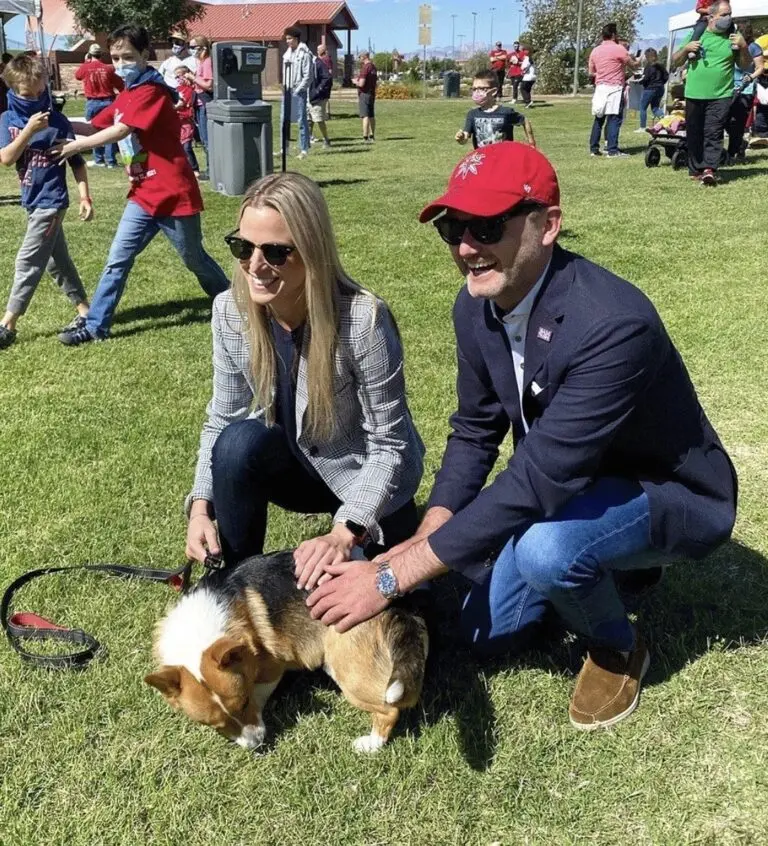 A joyful outdoor gathering, showcasing community connection and compassion with engaged individuals and a dog.