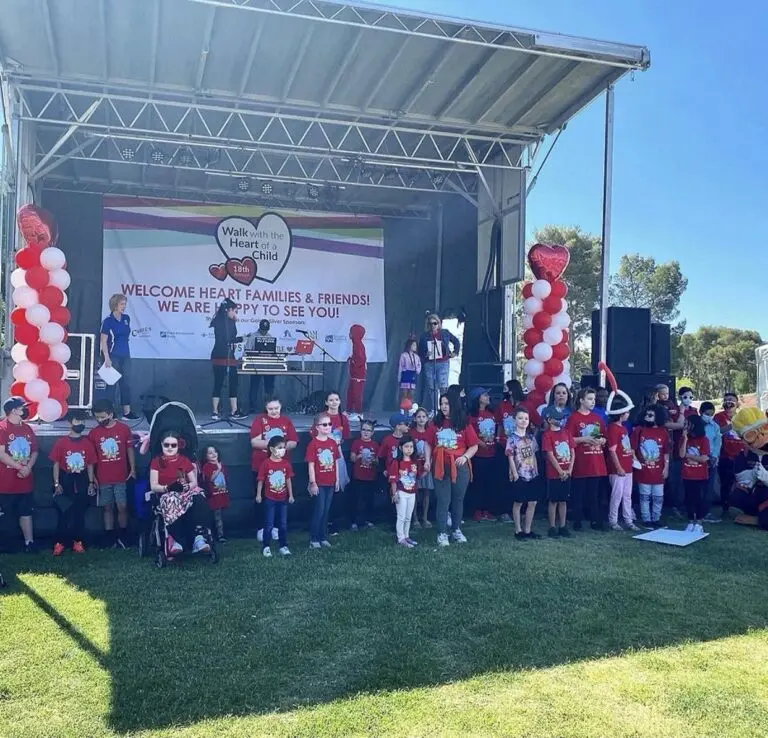 A vibrant community event showcasing children's joy, unity, and support for heart health.
