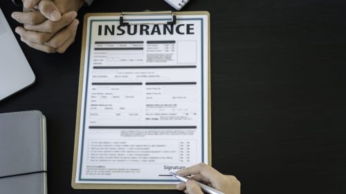A focused discussion on insurance, highlighting commitment and support during a critical process.
