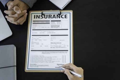 A focused discussion on insurance, highlighting commitment and support during a critical process.