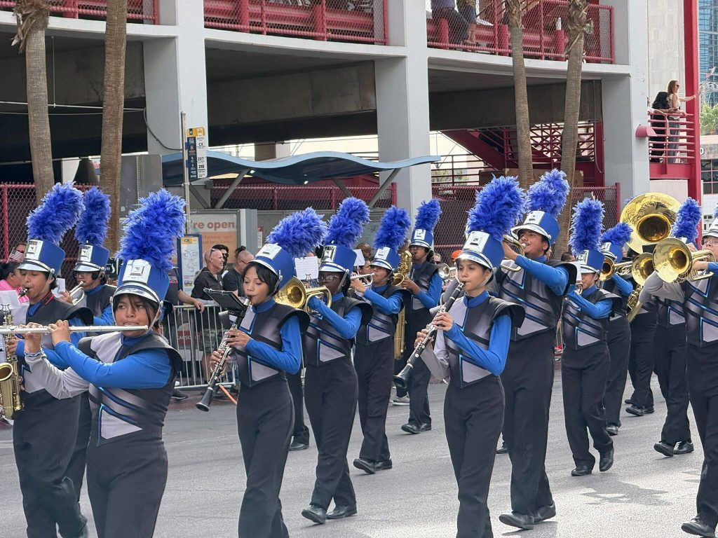 A vibrant marching band showcases unity and enthusiasm, embodying community spirit and resilience.