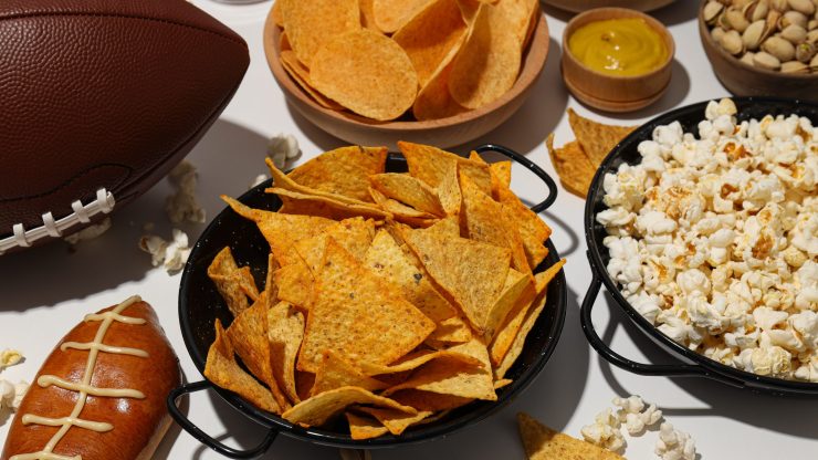 A vibrant spread of game day snacks evokes a sense of camaraderie and celebration.
