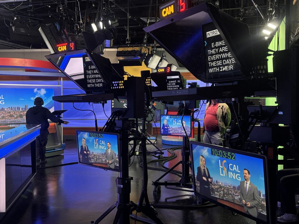 A dynamic newsroom setting, showcasing professionals engaged in impactful storytelling.