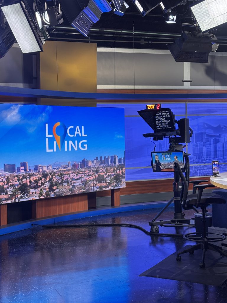 A modern studio setting with a vibrant backdrop, conveying professionalism and community engagement.