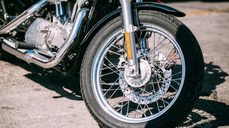 A close-up of a motorcycle wheel, symbolizing strength and resilience in personal injury advocacy.