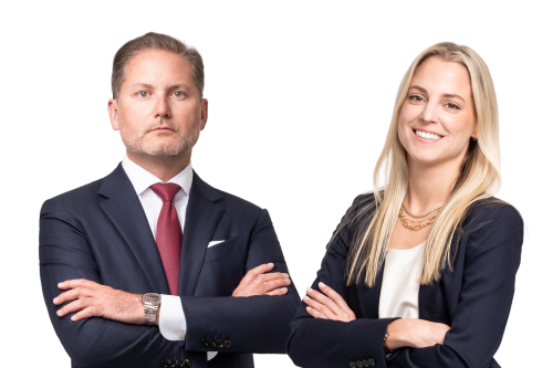 Two confident attorneys in professional attire, conveying trust, care, and strong advocacy.