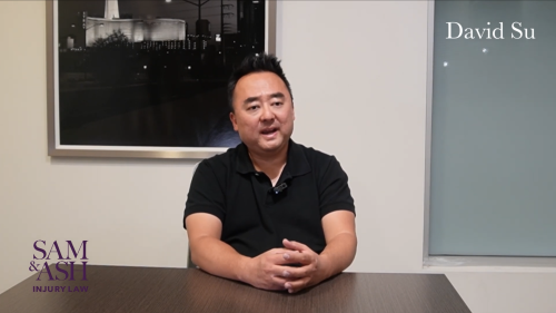 Confident man seated in modern office, conveying trust and dedication to client advocacy.