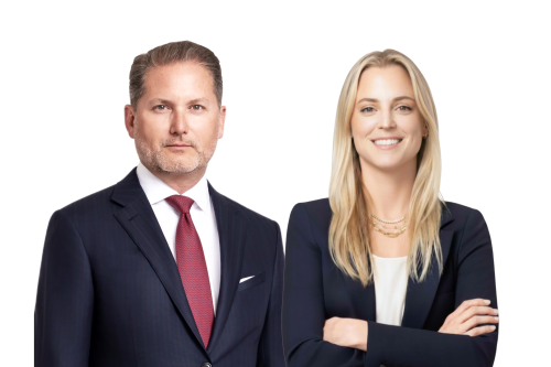 Confident male and female attorneys in professional attire, conveying trust and dedication to clients.