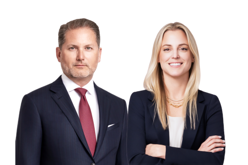 Confident male and female attorneys in professional attire, conveying trust and advocacy.