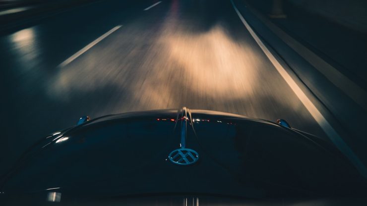 Dynamic night drive image showcasing motion blur as a car travels on a highway. Perfect for transportation themes.